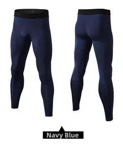 Detail view of navy blue compression pants with ergonomic seams and mesh panels
