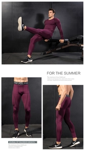 Detail of men's compression sports set in deep purple with elastic waist and pro stitching
