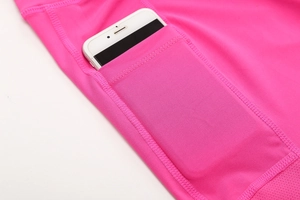 Close-up of high-elasticity rose pink yoga shorts featuring a functional side phone pocket