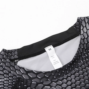 Detail view of athletic shirt neckline showing M size label and honeycomb fabric texture