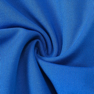 Detailed macro view of the royal blue compression sports fabric with ribbed texture