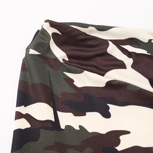 Close-up of high-elasticity wide waistband with jungle camouflage print on fitness yoga pants