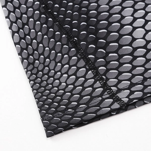 Close-up of seamless honeycomb texture and reinforced stitching on quick-dry sports shirt