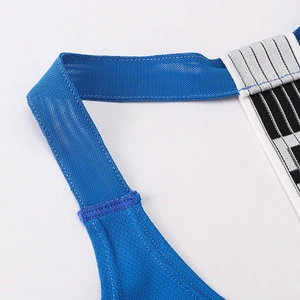 Detail of blue breathable mesh fabric and reinforced stitching on a sports vest