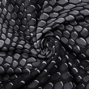 Close-up of snake skin pattern 3D printed fabric with ribbed texture for fitness wear
