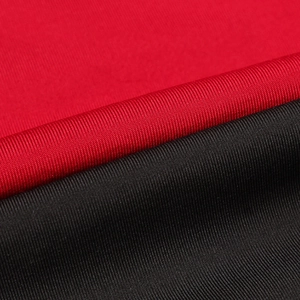 Detailed macro view of red and black high-elastic synthetic sports fabric texture