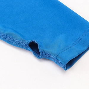 Detail of royal blue athletic shirt featuring high-elastic fabric and thumb hole cuffs