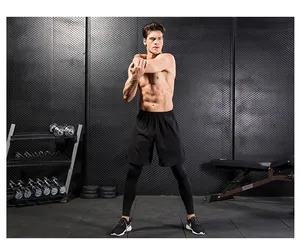 Detail of men's black 2-in-1 sports leggings and running shorts for gym training
