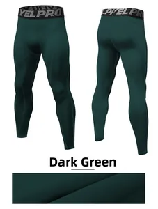 Detail view of dark green mens compression leggings with YEL PRO elastic waistband