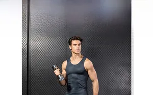 Detail of charcoal grey pro fitness vest showing 3D honeycomb texture and elastic fit