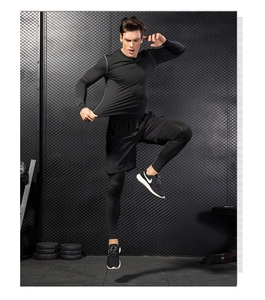 Dynamic view of men's compression base layer set showing high elasticity and fabric texture