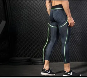 Detail of men's compression pants showing honeycomb texture and ergonomic stitching