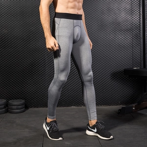 Men's grey PRO compression pants with breathable mesh panels for gym and running
