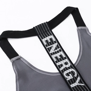 Women's breathable gray yoga tank top featuring black ENERGY printed back straps