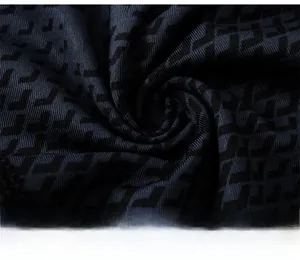 Close-up of navy blue quick-dry fabric with black geometric patterns and fine texture