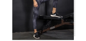 Detail of men's compression tights with hexagonal 3D patterns for gym training