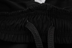 Detail of men's sports shorts elastic waistband with braided drawstring and mesh fabric