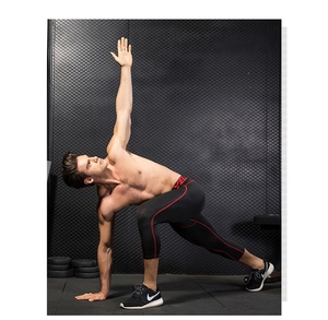 Detail of men's compression tights with red stitching and breathable mesh fabric
