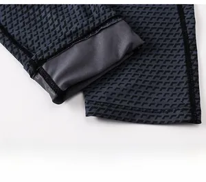 Detail of high-elasticity cuffs with flatlock stitching on men's gray compression pants