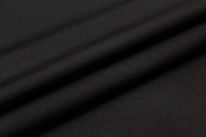 Macro shot of black high-density elastic knit fabric for men's athletic long sleeve shirt