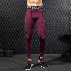 Men's burgundy compression pants with black stitching for fitness running and training
