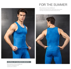 Macro details of men's blue 3D compression vest showing breathable honeycomb texture fabric
