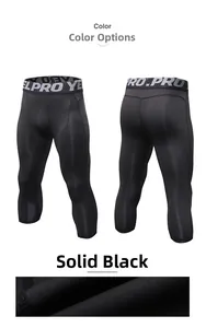 Detailed close-up of men's black athletic pro compression leggings with mesh fabric texture