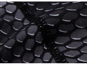 Macro detail of breathable honeycomb texture fabric and durable flatlock stitching on vest