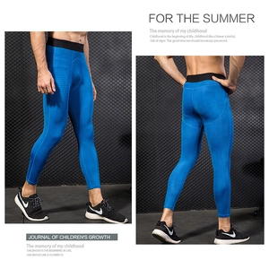 Detail of blue compression pants showing 3D honeycomb texture and elastic waistband
