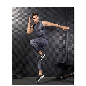Detail shot of men's compression suit with textured honeycomb pattern in a gym setting