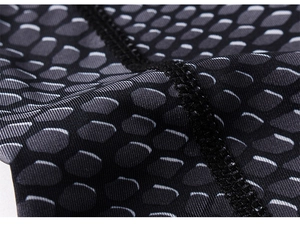 Macro detail of breathable honeycomb texture fabric with 3D print and reinforced stitching