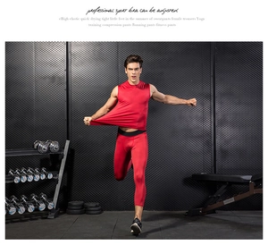 Close-up of red compression fitness suit set for men on gym background