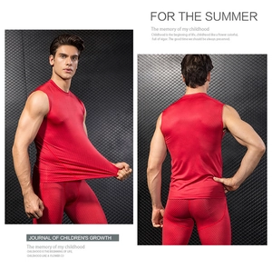 Close-up of red quick-dry compression top and leggings with honeycomb textured fabric