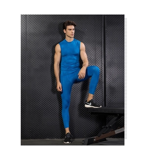 Detail of royal blue compression suit showing honeycomb breathable texture on vest and pants