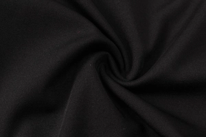 Détail de la texture macro du tissu en tricot élastique noir pour pantalon yoga