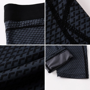 Macro details of men's compression tights showing high-elastic waistband and reinforced stitching
