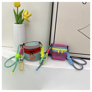 Detail of colorful mini mesh crossbody bags with adjustable woven straps and stitching