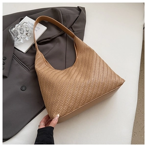 Detailed macro view of retro brown woven leather texture and elegant shoulder strap