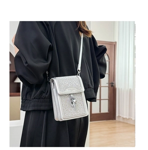 Silver glitter crossbody phone bag featuring leopard print sequins and metal pendant