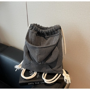 Detail of waffle fabric texture and hoodie-inspired drawstring pocket with cute ears