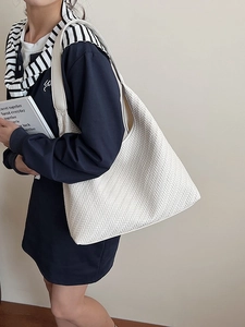 Chic cream woven shoulder bag with large capacity and hobo bucket style for daily use