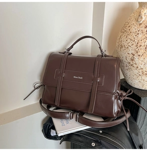 Detailed view of Moon SharK dark brown vintage leather bag with adjustable strap