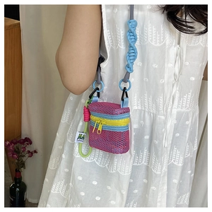 Detailed side view of multi-color mesh crossbody bag with braided rope strap and zipper