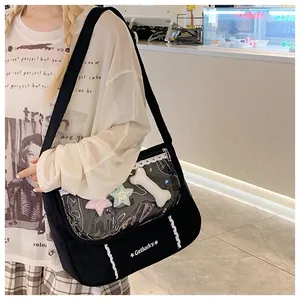 Detail of black canvas messenger bag with transparent PVC pocket and Getlucky text