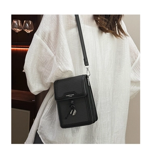Detail of black woven crossbody bag with silver charm and Fanwei fashion lettering