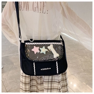 Close-up of black canvas ita bag featuring transparent PVC window and lace trimming details
