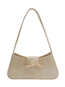 Chic beige pleated leather shoulder bag featuring a stylish bow and minimalist design