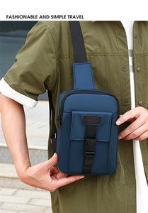Close-up of deep blue nylon cross-body bag featuring a sport label and black buckles