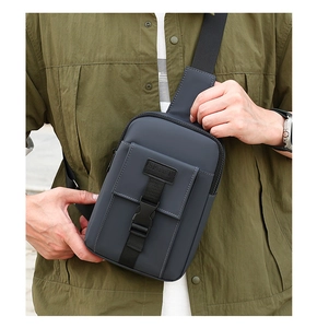 Detail of blue crossbody chest bag with adjustable strap and Sport logo patch for men