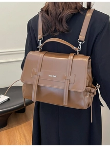 Vintage brown PU leather backpack with a flap cover and drawstring bow detail